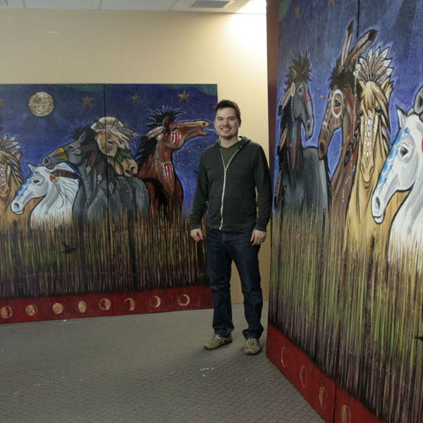 Aaron Paquette with horse print and original