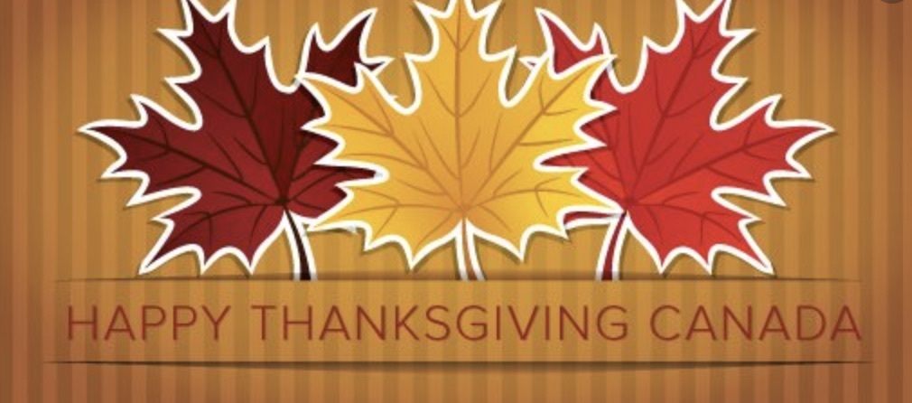 Orange background with Canadian Maple Leafs saying Happy Thanksgiving Canada